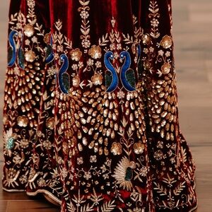 Shrara suit in deep maroon colour. It’s on a velvet fabric. Fits size XS-S.